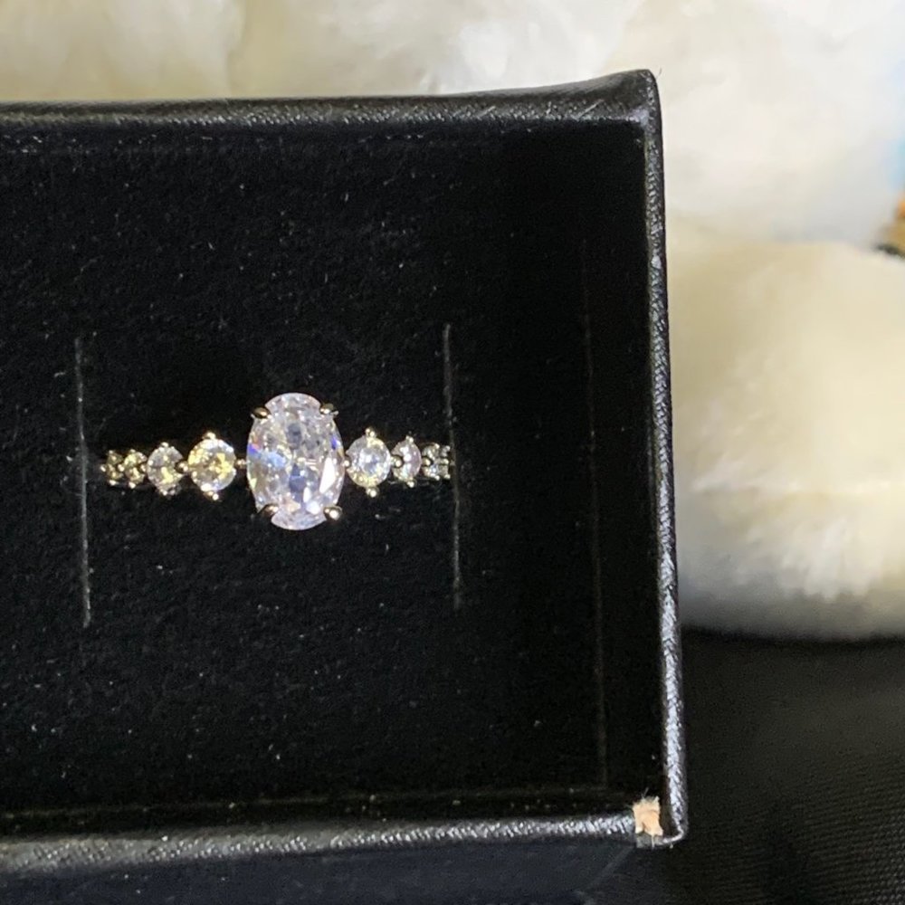 Silver Toned Ring with Oval Clear Stones With Eight Smaller Stones